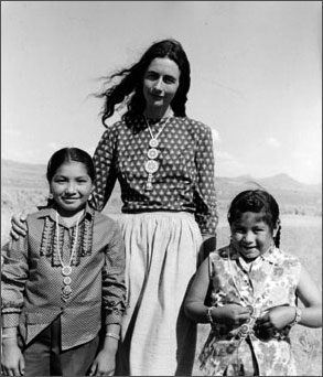 photo of Catherine Schuon with 2 Native American children
